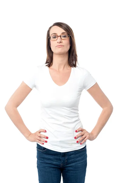 Woman standing with hands on waist — Stock Photo, Image