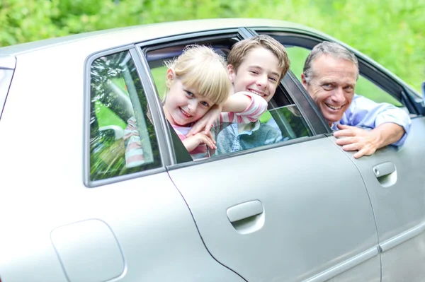 Father enjoying car drive with kids