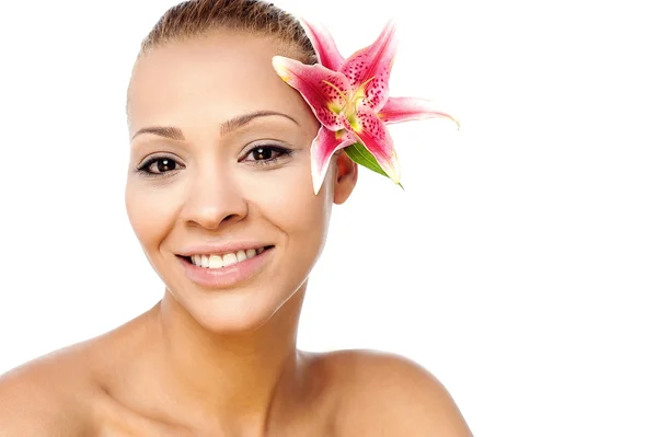 Woman with pink lily flower — Stock Photo, Image
