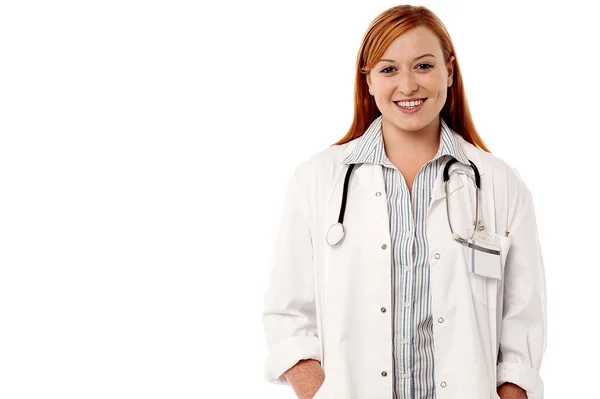 Doctor with hands on coat pockets — Stock Photo, Image