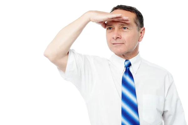 Corporate man searching for something — Stock Photo, Image