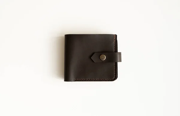 Top view of brown empty mans black handmade genuine leather wallet for banknotes and credit cards isolated on white background. Selective focus, copy space, Close up. — Stock Photo, Image