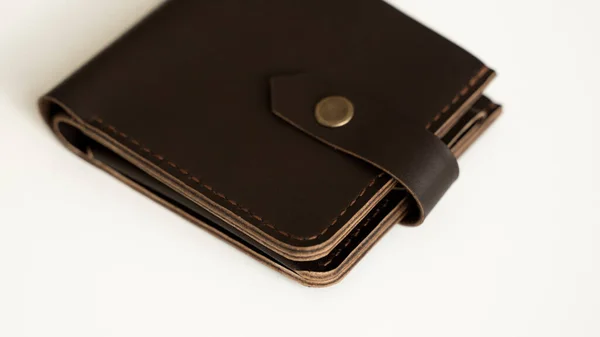 Top view of brown empty mans black handmade genuine leather wallet for banknotes and credit cards isolated on white background. Selective focus, copy space, Close up. — Stock Photo, Image