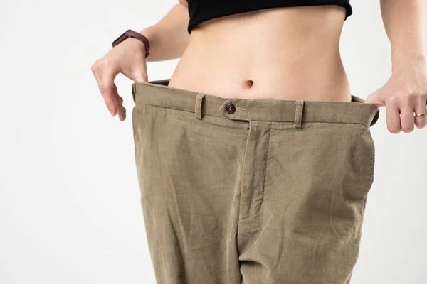 Slim Sporty Woman Beige Pants Showing Result Weight Loss White — ストック写真