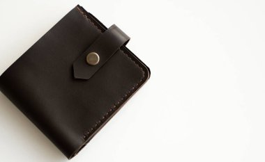 Mans handmade dark brown genuine leather wallets on a white background. Leather goods and accessory