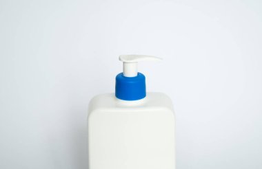 White unbranded plastic dispenser pump bottle on white background. Cosmetic package mockup, liquid soap flacon, hand sanitizer without label, shampoo organic spa, shower gel