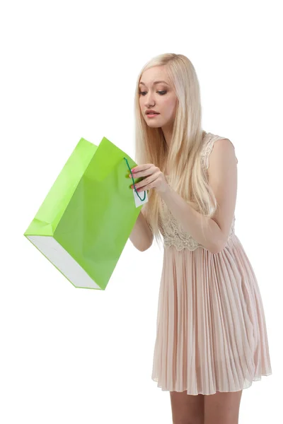 Woman looking to shopping bag — Stock Photo, Image