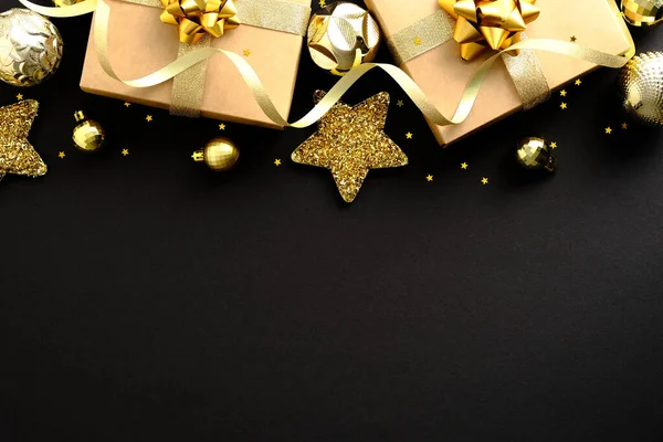 Christmas Gold Baubles Stars Gifts Dark Black Background Flat Lay — Stock Photo, Image