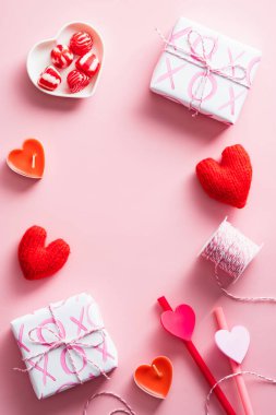 Happy Valentines Day concept. Vertical banner with gifts, hearts, sweets on pink background.