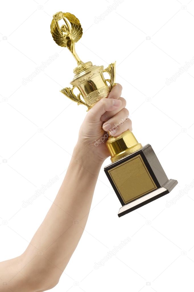 Trophy in hand isolated on white background