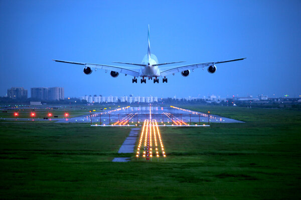 passenger plane fly up over take-off runway from airport