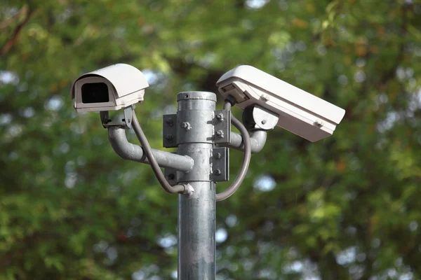 White CCTV camera watching for security 24 hours — Stock Photo, Image