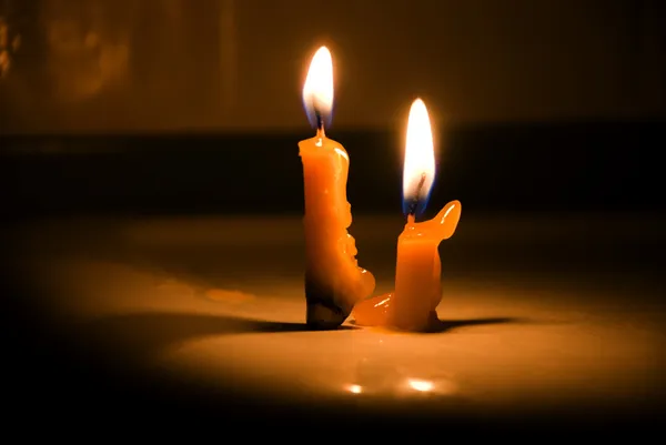 Old candle on the black background — Stock Photo, Image