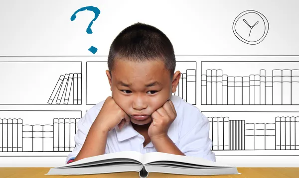 Young boy tired of reading — Stock Photo, Image