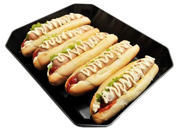 Hot dogs on a pan on white — Stock Photo, Image