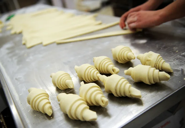 Baker forming a dough mix — Stock Photo, Image