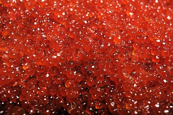 Roter Kaviar auf dem Hintergrund — Stockfoto
