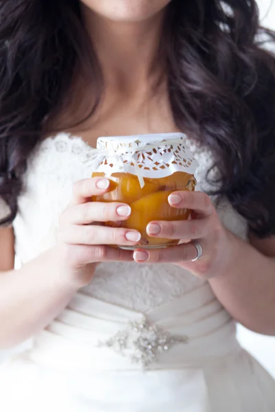 Bride is holding a jam