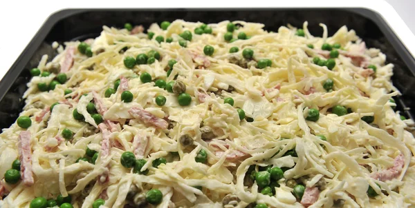 Meat salad with cheese and green peas — Stock Photo, Image