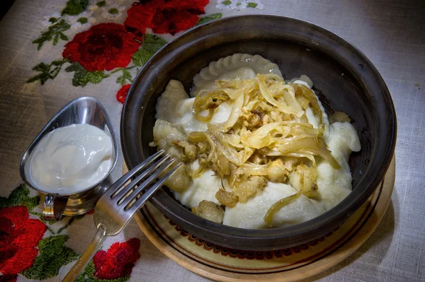 Tasty dumplings with fried onion — Stock Photo, Image