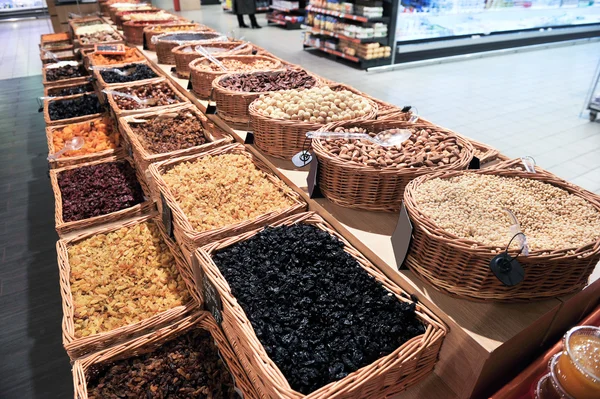 Various dried fruits and nuts in market — Stock Photo, Image