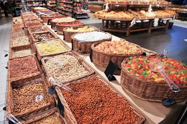 Various dried fruits and nuts in market — Stock Photo, Image