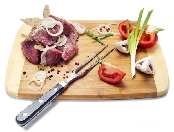 Pieces of raw meat on the board — Stock Photo, Image