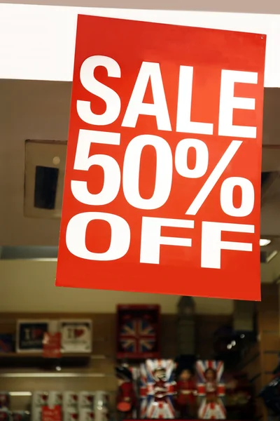 Sale signs in shop window — Stock Photo, Image