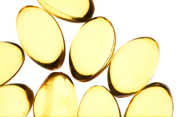 Yellow pills isolated background — Stock Photo, Image