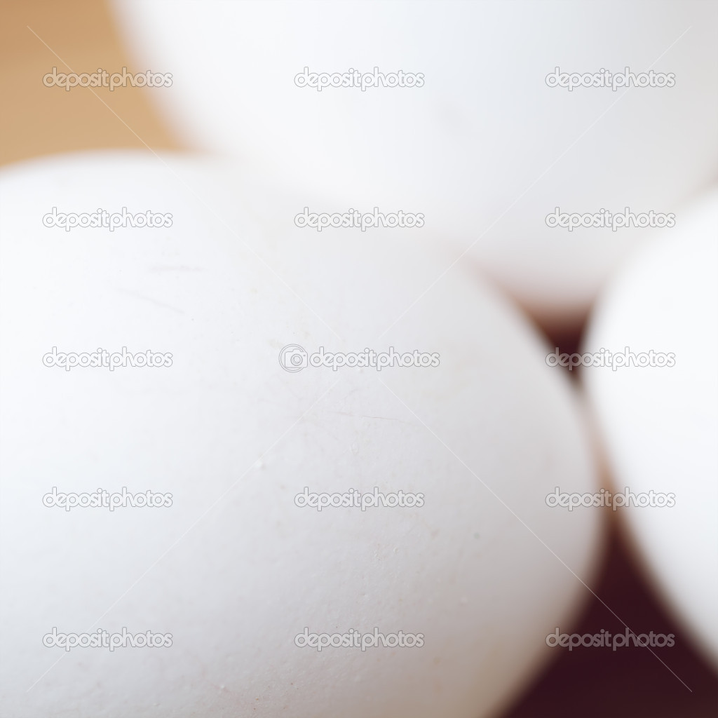 White eggs on the wooden table