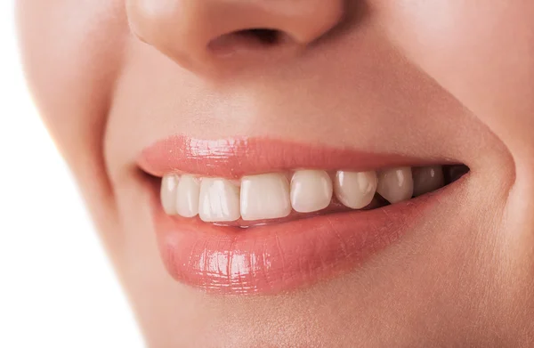 Lips and tooth closeup of beautiful young woman isolated on whit — Stock Photo, Image