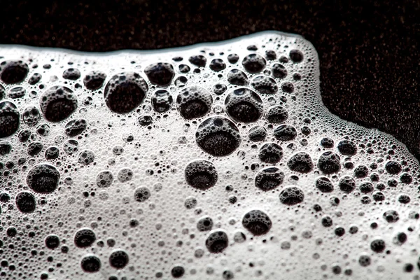 Foam bubbles abstract dark background — Stock Photo, Image