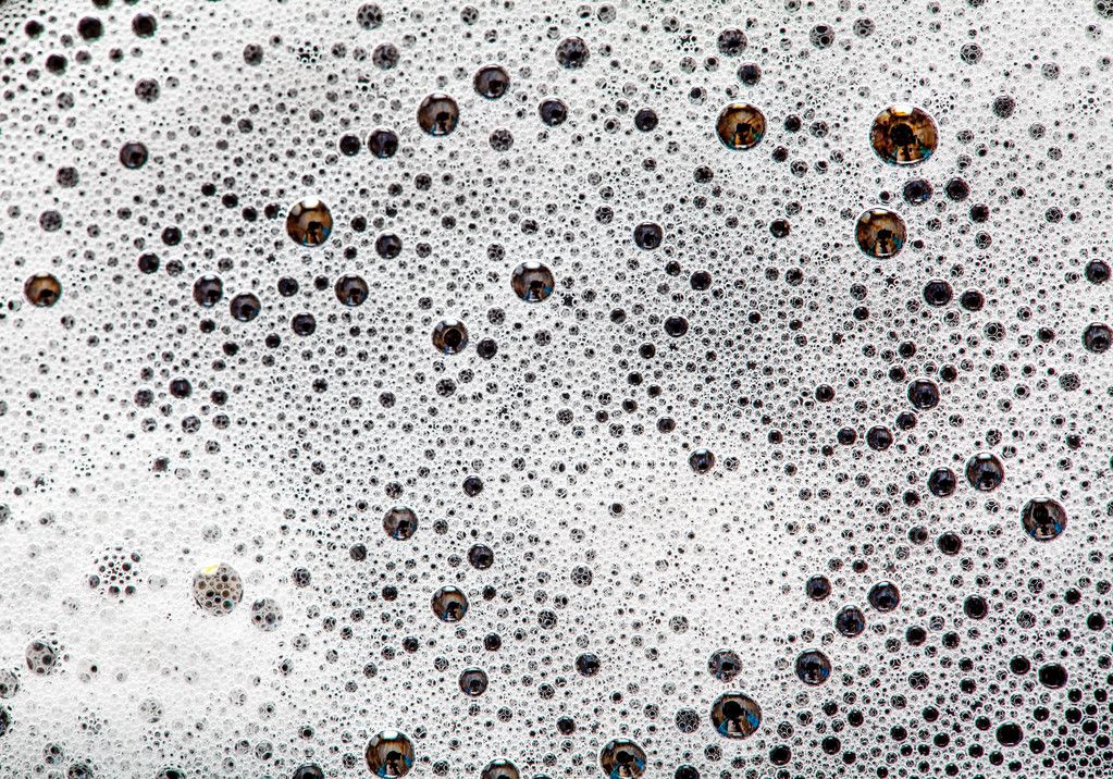 Foam bubbles abstract dark background