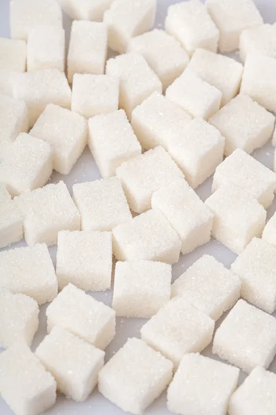 White sweet sugar cubes background — Stock Photo, Image