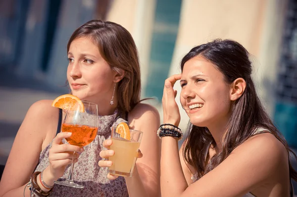 Two Young Women Cheering with Cold Drinks — Stock Photo, Image