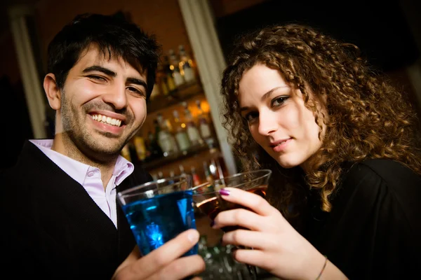Friends toasting at the disco — Stock Photo, Image