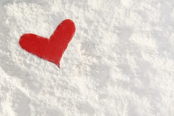 Shape of a red heart in flour — Stock Photo, Image