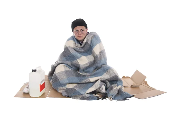 Homeless sitting on cardboard — Stok fotoğraf