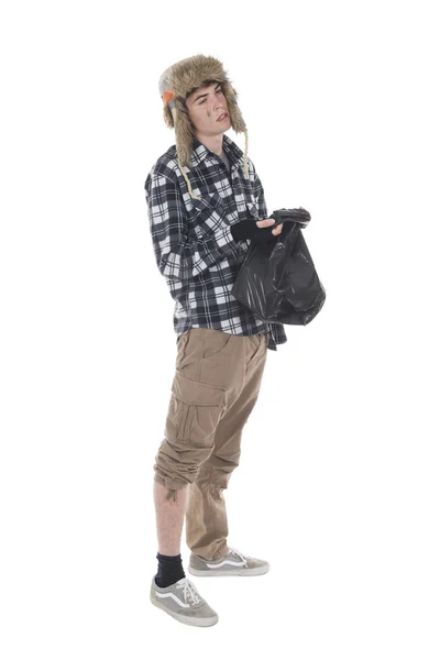 Homeless wanderer with a garbage bag in hand — Stock Photo, Image