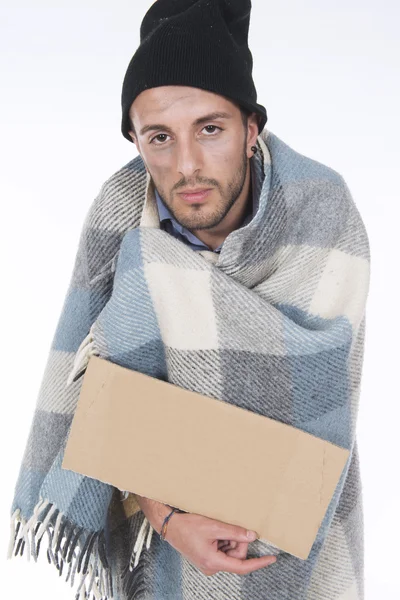 Homeless wrapped in his blanket begging with a sign — Stock Photo, Image