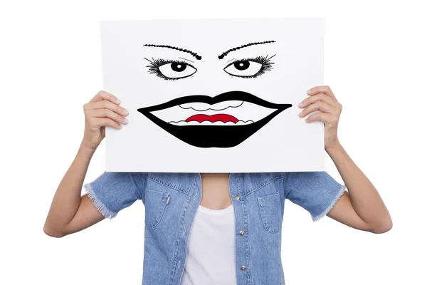 Jovencita sosteniendo un cartel con dibujo delante de su cara —  Fotos de Stock
