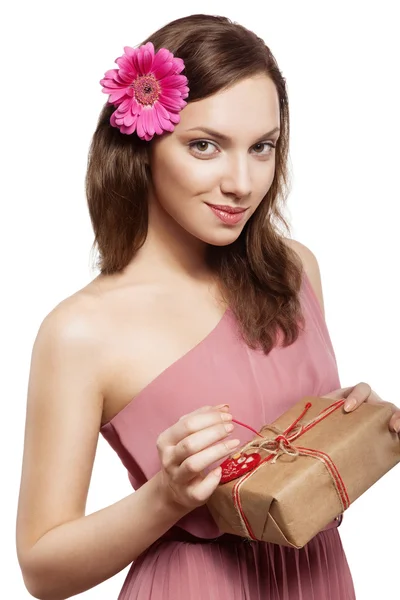 Brunette girl holding gift box — Stock Photo, Image