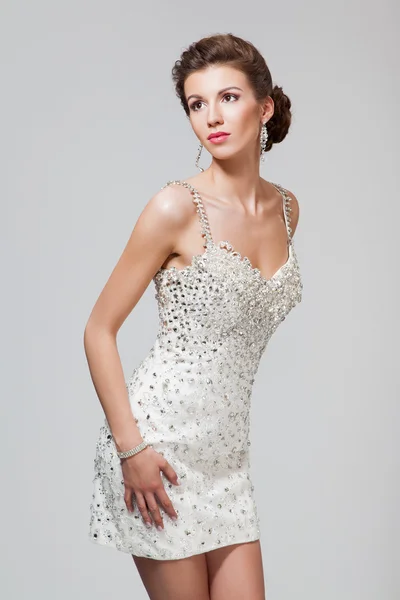 Beautiful young woman in elegant dress — Stock Photo, Image