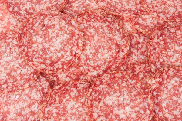 Salami bakgrund med många bitar — Stockfoto