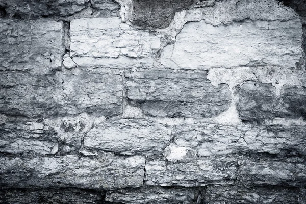 Cracked scratched plaster stone wall — Stock Photo, Image