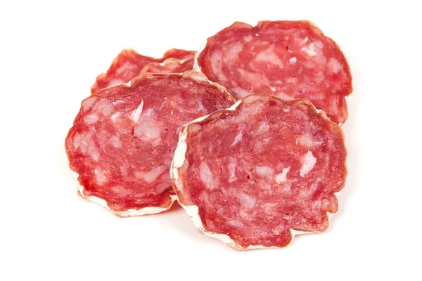 Pile of salchichon, red spanish salami, on a white — Stock Photo, Image