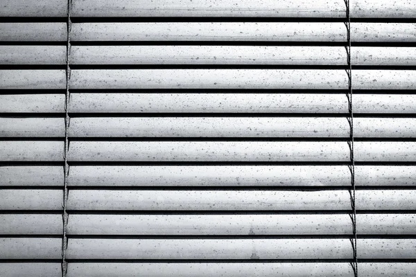 Grey shutters over a shop doors — Stock Photo, Image