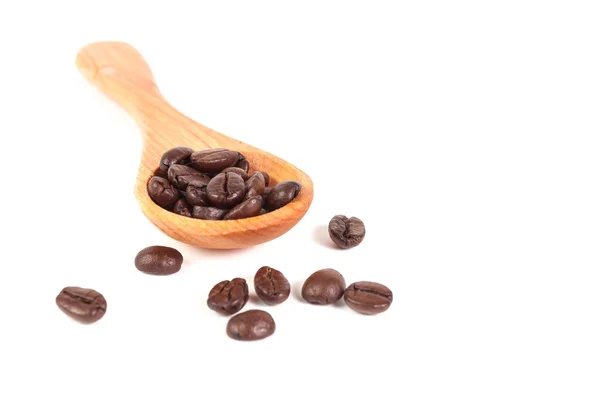 Coffee beans and wood spoon — Stock Photo, Image