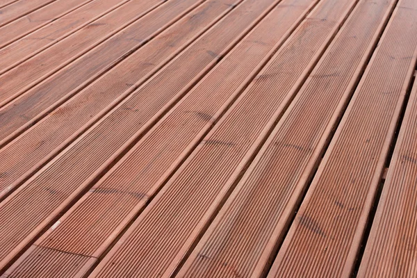 Bagnato pavimento terrazza in legno sfondo — Foto Stock