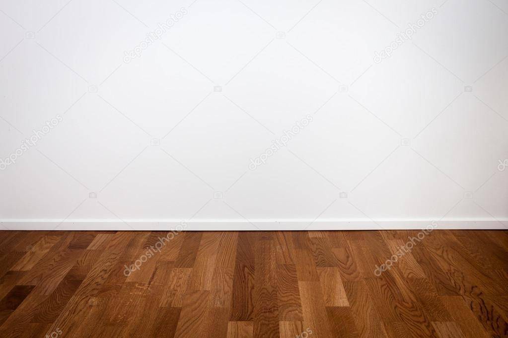 Empty white wall and wooden floor